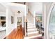 Bright foyer showcasing hardwood floors, staircase, and an open floor plan at 1558 Amberwood Creek Nw Dr, Kennesaw, GA 30152