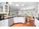 Bright kitchen featuring stainless steel appliances, hardwood floors, and an open design at 1558 Amberwood Creek Nw Dr, Kennesaw, GA 30152