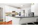 Modern kitchen with granite countertops, stainless steel appliances, and bar seating at 1558 Amberwood Creek Nw Dr, Kennesaw, GA 30152