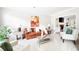 Inviting living room featuring plush carpeting and neutral decor throughout at 1558 Amberwood Creek Nw Dr, Kennesaw, GA 30152
