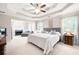 Spacious main bedroom with tray ceiling, sitting area and lots of natural light at 1558 Amberwood Creek Nw Dr, Kennesaw, GA 30152