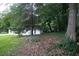 View of the backyard and mature trees surrounding the lot at 3042 Monterey Dr, Decatur, GA 30032