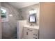 This bathroom features grey tile, glass enclosed shower, and modern fixtures at 3042 Monterey Dr, Decatur, GA 30032