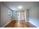 Bedroom with a glass sliding door leading to an ensuite bathroom and hardwood floors at 3042 Monterey Dr, Decatur, GA 30032