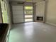 Spacious garage with a fireplace and a modern glass door at 3042 Monterey Dr, Decatur, GA 30032