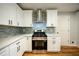 This kitchen has stainless steel appliances, gas range, and stylish white cabinets at 3042 Monterey Dr, Decatur, GA 30032