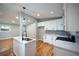 Bright kitchen featuring white cabinets, granite countertops, stainless appliances and modern fixtures at 3042 Monterey Dr, Decatur, GA 30032