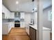 Bright kitchen features stainless appliances, white cabinets and light countertops at 3042 Monterey Dr, Decatur, GA 30032