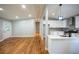Open-concept living room next to kitchen with hardwood floors and recessed lighting at 3042 Monterey Dr, Decatur, GA 30032