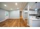 Large open-concept living room next to kitchen with beautiful hardwood floors at 3042 Monterey Dr, Decatur, GA 30032