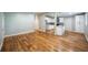 Open-concept living space featuring hardwood floors and seamless flow into a modern kitchen at 3042 Monterey Dr, Decatur, GA 30032