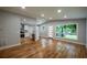 Spacious living area with open floor plan, hardwood floors and updated kitchen at 3042 Monterey Dr, Decatur, GA 30032