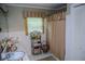 Cozy bathroom with vintage decor, including patterned wallpaper and a shower with curtain at 3206 Pyrite Sw Cir, Atlanta, GA 30331