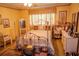 Vintage style bedroom with yellow walls, antique furniture, and a decorative metal bed frame at 3206 Pyrite Sw Cir, Atlanta, GA 30331