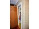 View into closet showing shelving, clothes and vintage wallpaper at 3206 Pyrite Sw Cir, Atlanta, GA 30331