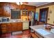 Functional kitchen with wooden cabinets, vintage appliances, and a cozy dining area, perfect for Gathering meals at 3206 Pyrite Sw Cir, Atlanta, GA 30331