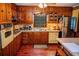 Functional kitchen with wooden cabinets, vintage appliances, and a cozy dining area, perfect for Gathering meals at 3206 Pyrite Sw Cir, Atlanta, GA 30331