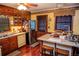 Practical kitchen with wooden cabinets, vintage appliances, and a functional island with seating for casual dining at 3206 Pyrite Sw Cir, Atlanta, GA 30331