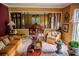 Cozy living room with comfortable seating, decorative accents, and an open view into the adjacent dining area at 3206 Pyrite Sw Cir, Atlanta, GA 30331