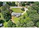 Aerial view showing the home on a sprawling lot with mature trees and circular driveway at 35 Brookside Ct, Villa Rica, GA 30180