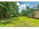 Spacious backyard with lush green grass, mature trees, and established landscaping at 35 Brookside Ct, Villa Rica, GA 30180