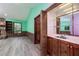 Bar area featuring a sink, cabinet storage, and access to other rooms at 35 Brookside Ct, Villa Rica, GA 30180