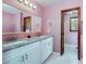 Bathroom featuring double sink vanity, framed mirror, and white tile floor at 35 Brookside Ct, Villa Rica, GA 30180