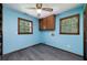 Cozy bedroom with wood-framed windows, closet, and new flooring at 35 Brookside Ct, Villa Rica, GA 30180
