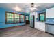 Bright kitchen with stainless steel refrigerator and wooden framed windows at 35 Brookside Ct, Villa Rica, GA 30180