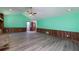 Bright living room with ample space, wood paneling, new floors, and access to other rooms at 35 Brookside Ct, Villa Rica, GA 30180