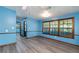 Spacious living room with new flooring, neutral paint and large windows offering ample light at 35 Brookside Ct, Villa Rica, GA 30180