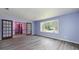 Bright living room with a bay window and gray flooring at 35 Brookside Ct, Villa Rica, GA 30180