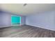 Spacious living room with gray floors and teal-painted walls at 35 Brookside Ct, Villa Rica, GA 30180