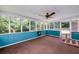 Bright sunroom with multiple windows providing natural light and views of the backyard at 35 Brookside Ct, Villa Rica, GA 30180