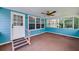Bright sunroom with multiple windows providing natural light and access to the outdoors at 35 Brookside Ct, Villa Rica, GA 30180