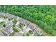 Aerial view of the neighborhood, showcasing the home's location among mature trees at 4590 Sierra Creek Dr, Hoschton, GA 30548