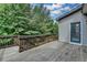 Relax on this back deck overlooking the trees in this cozy home at 4590 Sierra Creek Dr, Hoschton, GA 30548