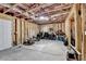 Unfinished basement space awaiting customization with exposed framing and plenty of room for activities at 4590 Sierra Creek Dr, Hoschton, GA 30548