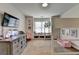 Bright bedroom with a bunk bed, dresser, and TV offering a cozy and functional space at 4590 Sierra Creek Dr, Hoschton, GA 30548