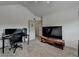 Carpeted bedroom featuring a vaulted ceiling, a ceiling fan, and a large TV at 4590 Sierra Creek Dr, Hoschton, GA 30548