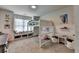 Bedroom featuring carpet flooring, loft bed, shelving, and colorful decorations at 4590 Sierra Creek Dr, Hoschton, GA 30548