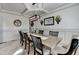 Elegant dining room with modern chandelier and decorative wall accents offers an ideal space for gatherings at 4590 Sierra Creek Dr, Hoschton, GA 30548