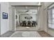 Elegant dining room with tray ceiling, chandelier, and ample seating, perfect for gatherings at 4590 Sierra Creek Dr, Hoschton, GA 30548
