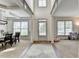 Inviting entryway featuring neutral tones, hardwood floors, a decorative rug, and plenty of natural light at 4590 Sierra Creek Dr, Hoschton, GA 30548