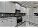 Well-equipped kitchen with granite countertops, stainless steel appliances, and ample cabinet space at 4590 Sierra Creek Dr, Hoschton, GA 30548