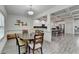 Dining Area featuring table with chairs and kitchen view with breakfast bar at 4590 Sierra Creek Dr, Hoschton, GA 30548