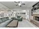 Inviting living room with open layout, fireplace, and seamless connection to kitchen and staircase at 4590 Sierra Creek Dr, Hoschton, GA 30548