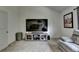 Spacious living room with large television and ample seating at 4590 Sierra Creek Dr, Hoschton, GA 30548