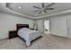 Serene main bedroom featuring tray ceilings and modern ceiling fan at 4590 Sierra Creek Dr, Hoschton, GA 30548