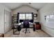 Home office with vaulted ceiling, carpet flooring, large desk, and a whiteboard at 4590 Sierra Creek Dr, Hoschton, GA 30548